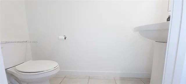 a view of staircase with white walls