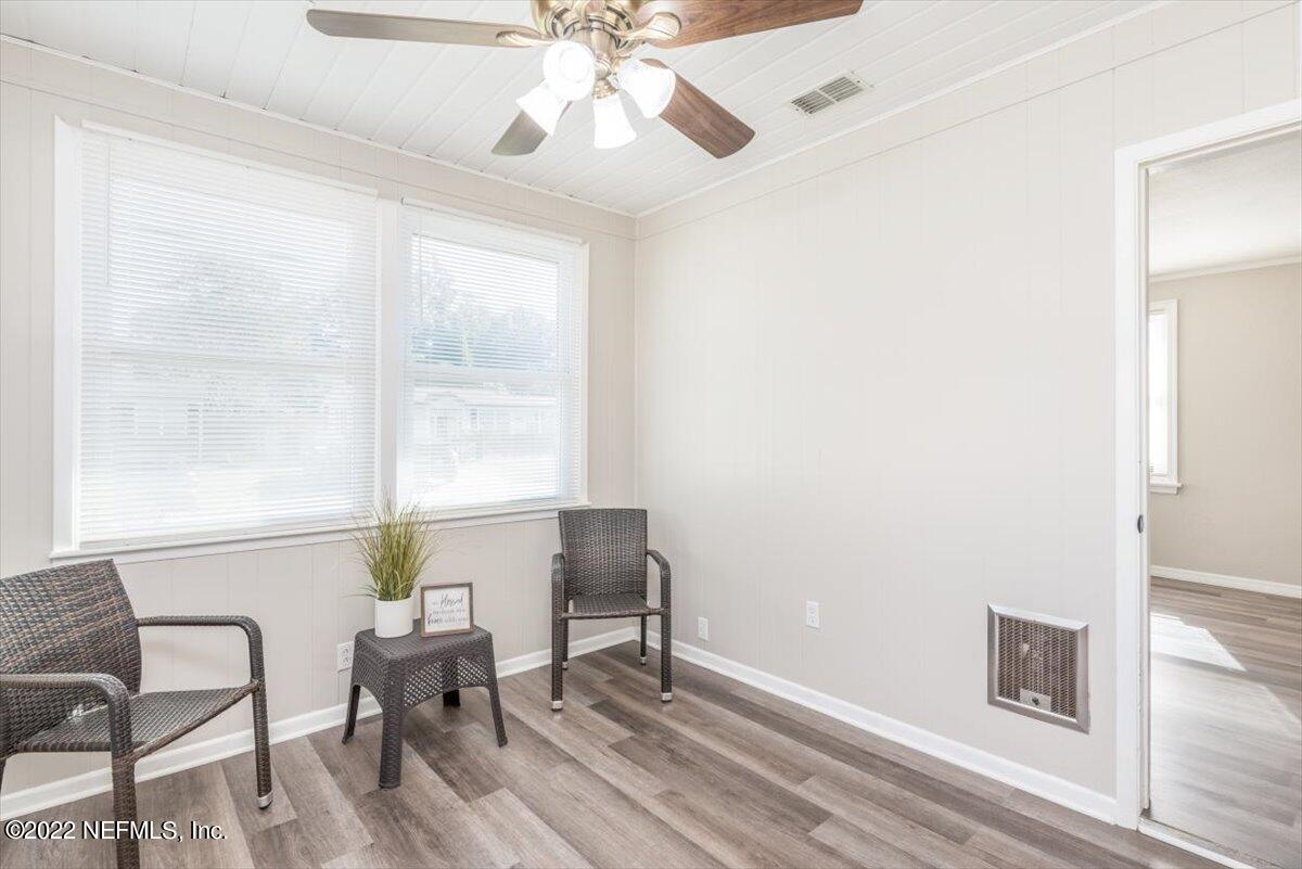 1720 Mayfair Road Jacksonville, FL 32207 - Photo 5 of 31 a workspace with wooden floor and a window