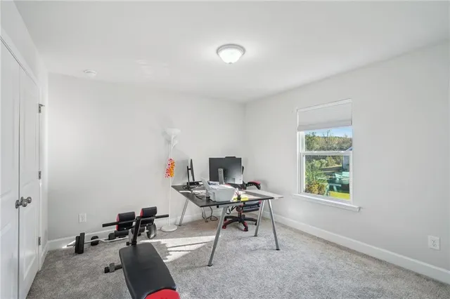 a workspace with furniture and a window