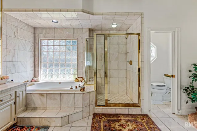 a bathroom with a tub shower and sink