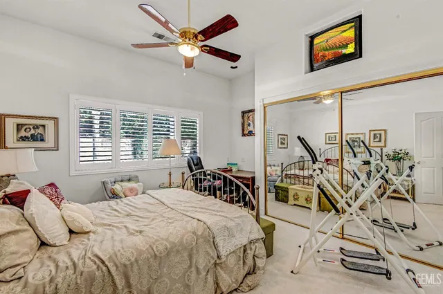 a bedroom with furniture and windows