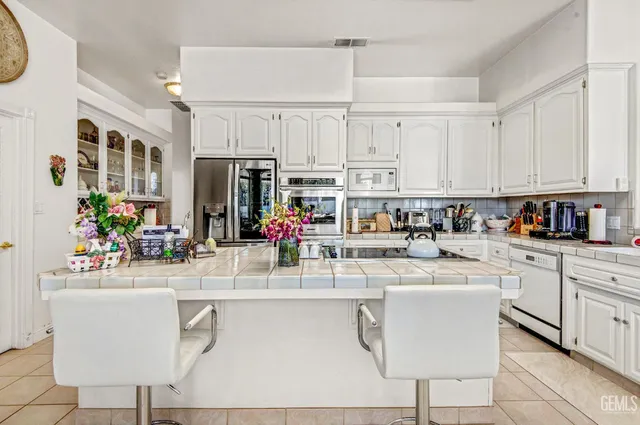 a kitchen with a sink cabinets and window