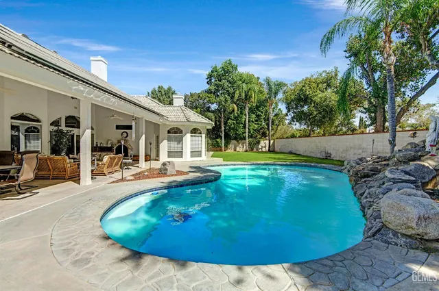 a view of a swimming pool with a patio