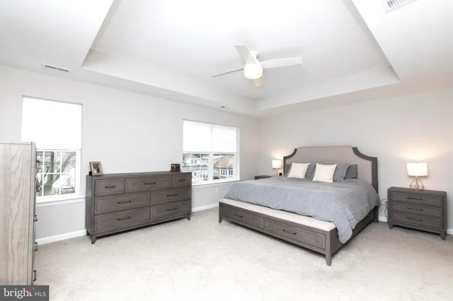 a spacious bedroom with a bed and window