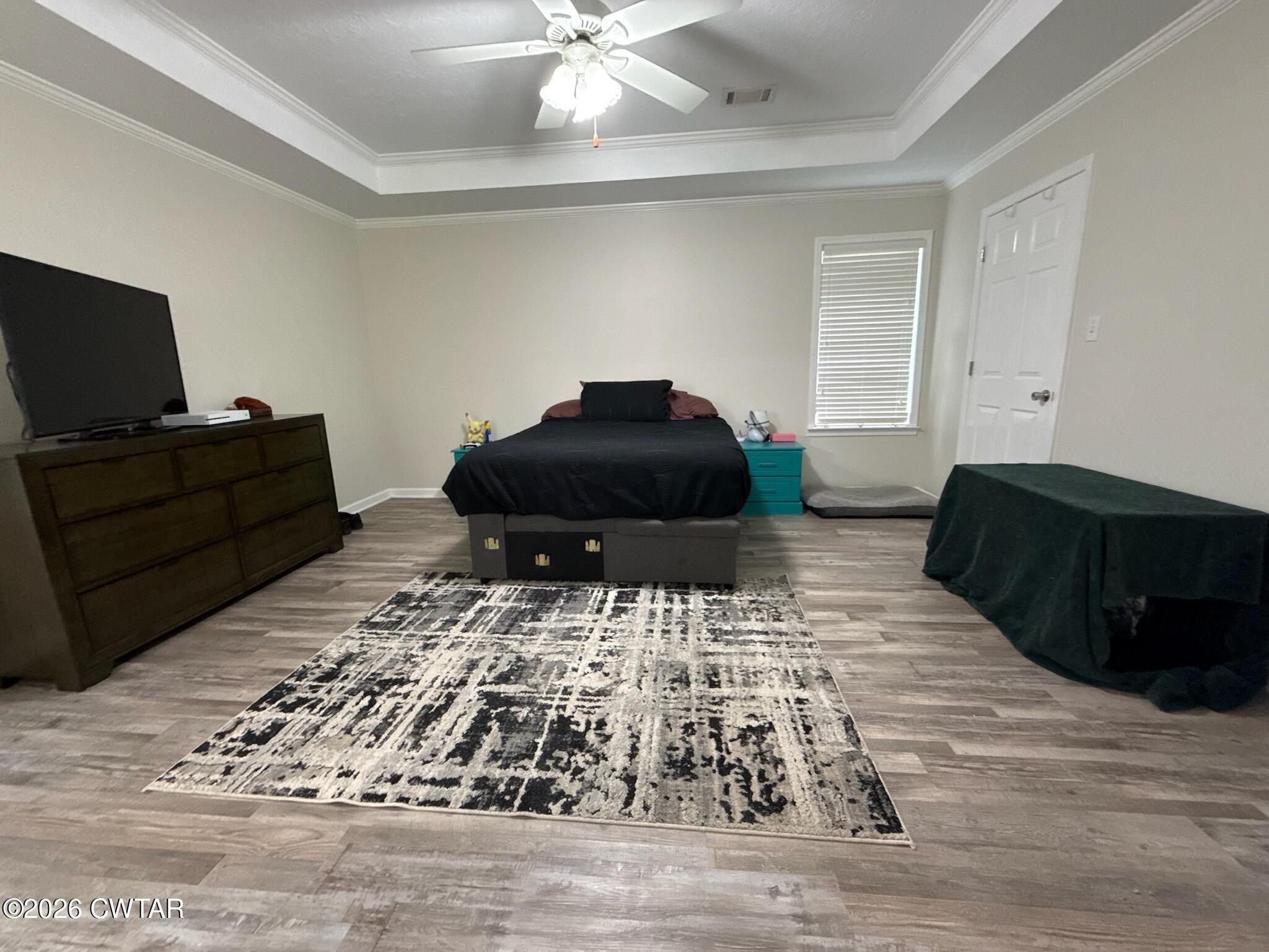 126 Waldunn Cove Rutherford, TN 38369 - Photo 7 of 18 a living room with a couch and a flat screen tv