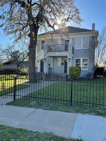 a view of a house with a backyard and a garden