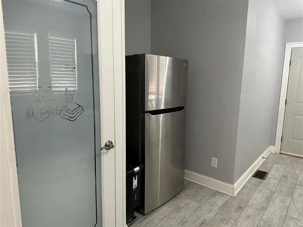 a view of a kitchen from the hallway