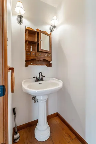 a bathroom with a sink and mirror