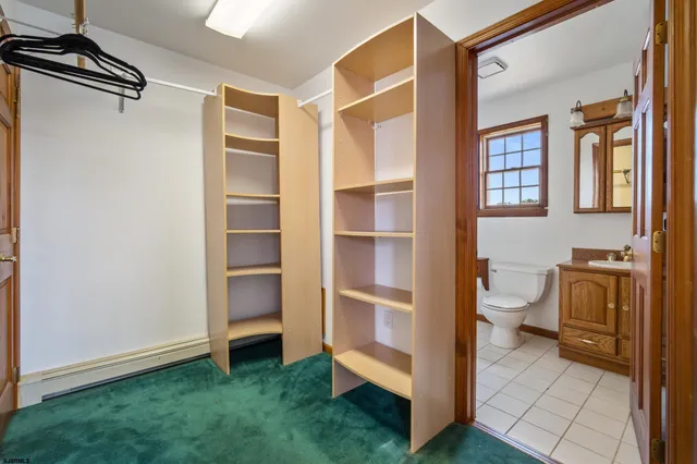 a view of bathroom with a sink and a toilet