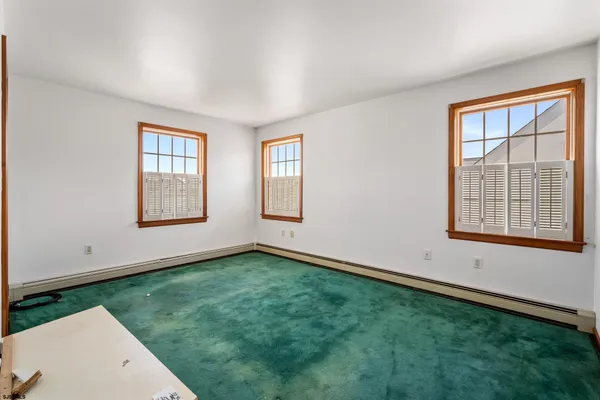 an empty room with windows