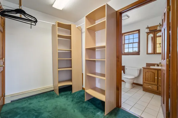 a view of bathroom with a sink and a toilet