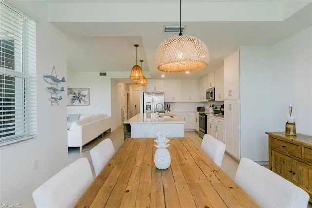 a view of kitchen and dining room with wooden floor