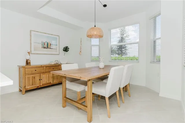 a dining room with furniture and window