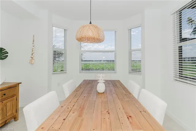a view of wooden floor and windows in a room