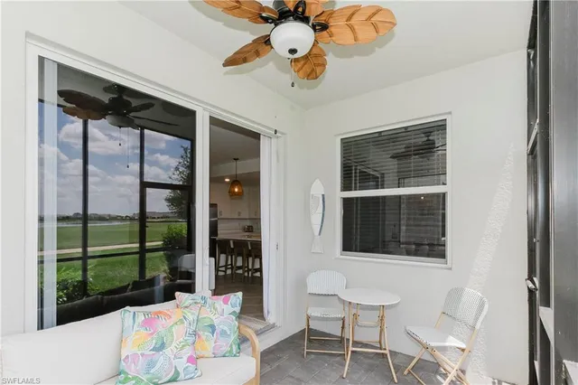 a bedroom with a bed and large window