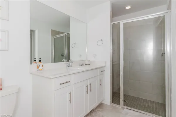a bathroom with double sink and mirror