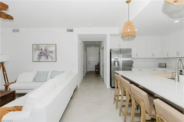 a kitchen with stainless steel appliances a refrigerator and a sink
