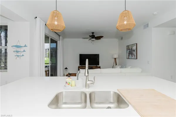 a kitchen with a sink and a refrigerator