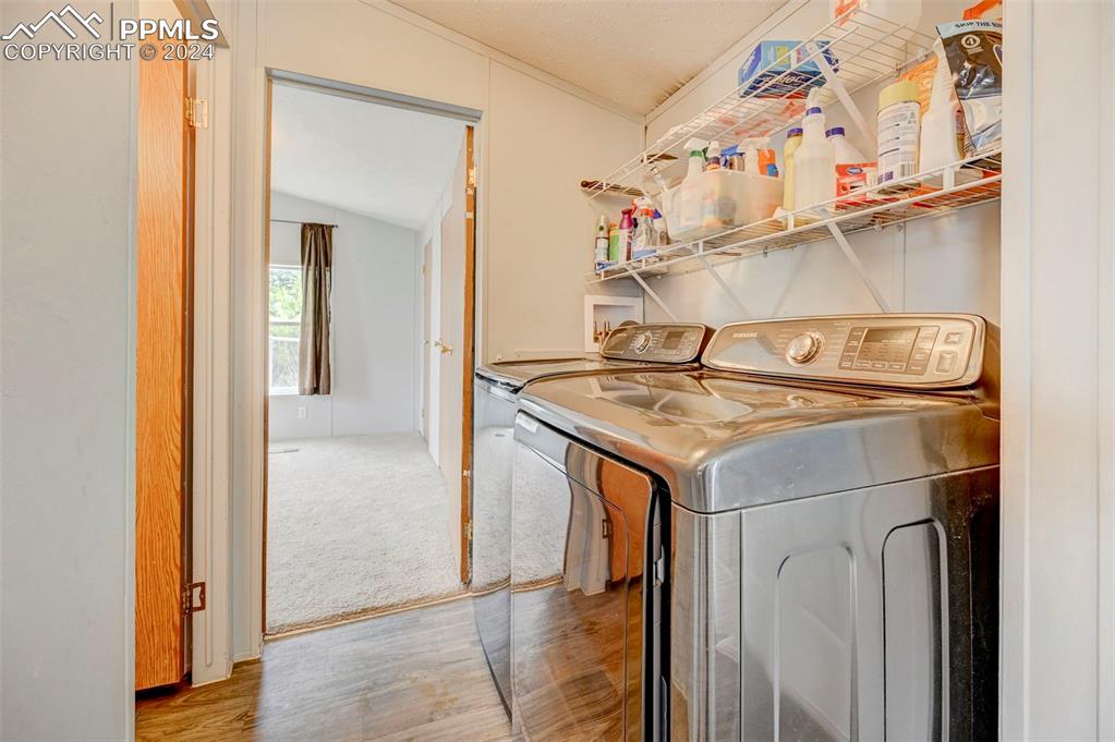 804 Sioux Avenue Simla, CO 80835 - Photo 14 of 17 a utility room with dryer and washer