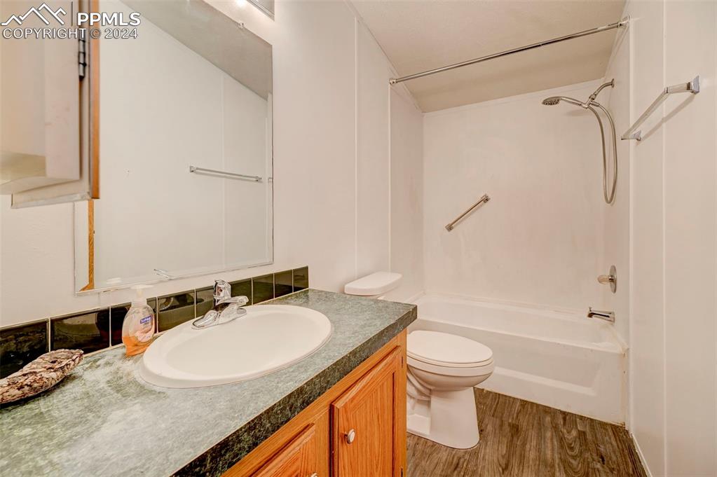 804 Sioux Avenue Simla, CO 80835 - Photo 15 of 17 a bathroom with a granite countertop sink toilet and shower