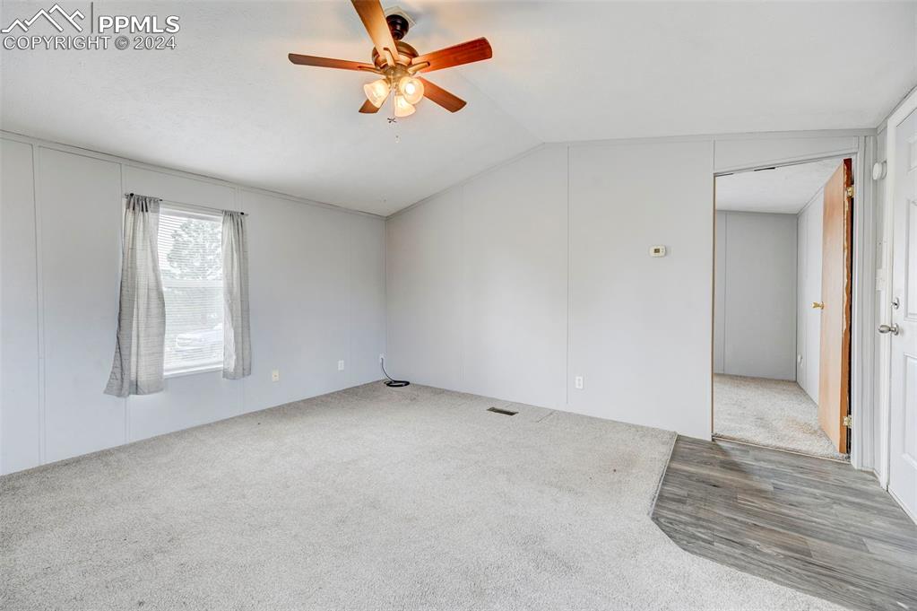 804 Sioux Avenue Simla, CO 80835 - Photo 9 of 17 an empty room with windows and fan