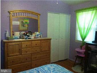 8514 Stevenswood Road Baltimore, MD 21244 - Photo 13 of 15 a bathroom with a sink a mirror and a window