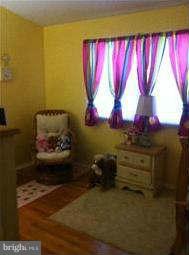 8514 Stevenswood Road Baltimore, MD 21244 - Photo 10 of 15 a room with a bed and a window