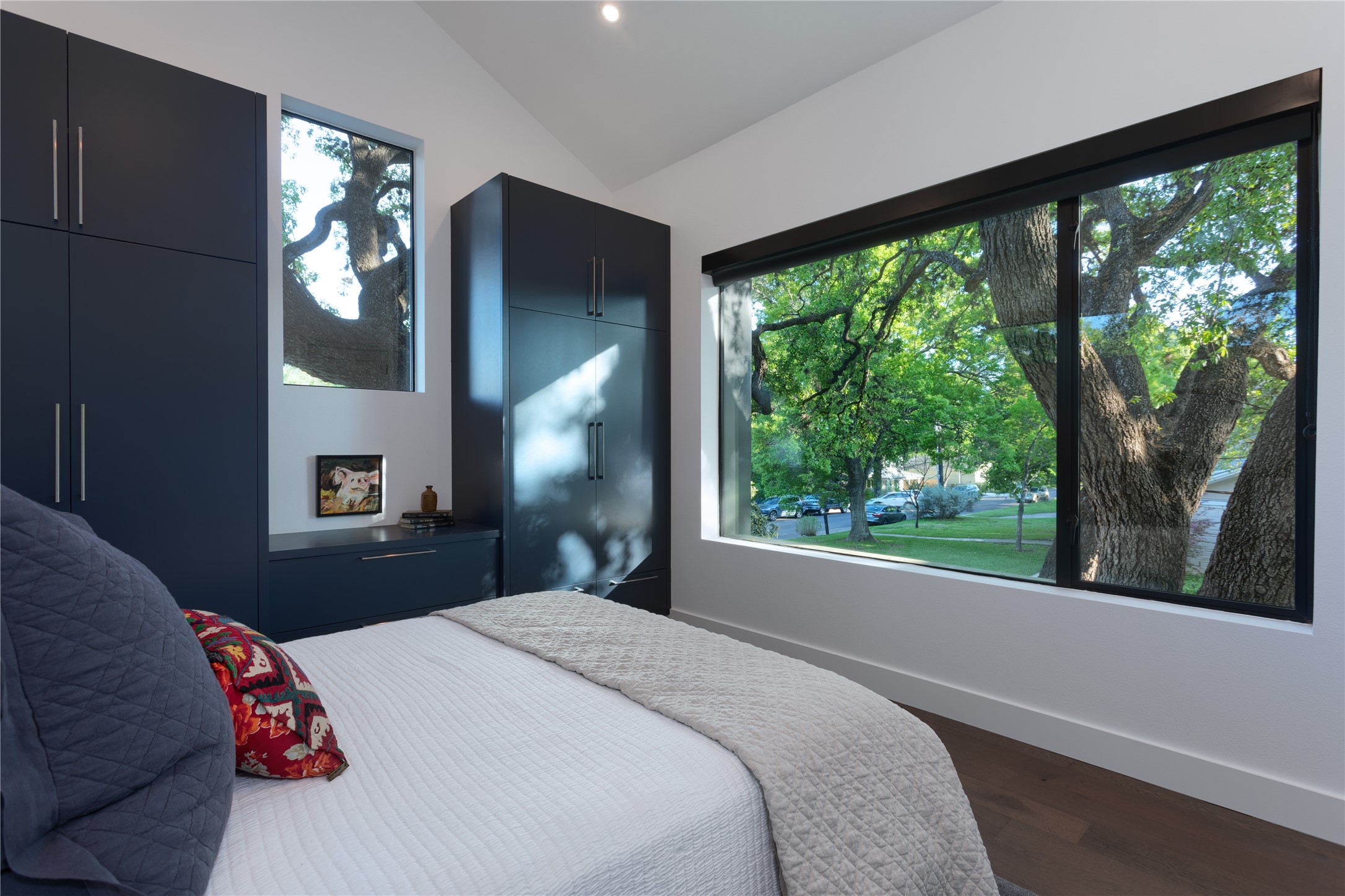 700 Jessie Street Austin, TX 78704 - Photo 26 of 40 ADU primary bedroom featuring dark wood-type flooring, lofted ceiling, and recessed lighting