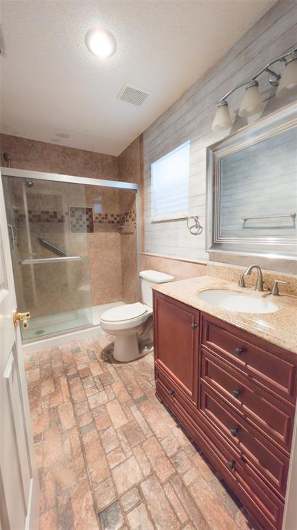 9357 Southwest 82nd Terrace, Unit C Ocala, FL 34481 - Photo 15 of 30 a bathroom with a sink toilet and shower