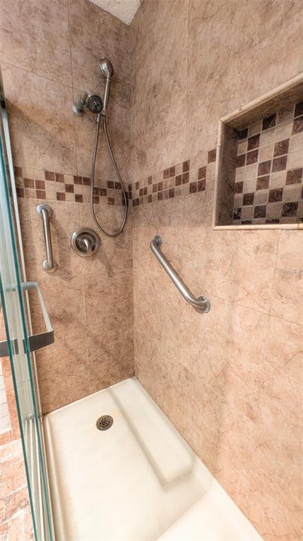 9357 Southwest 82nd Terrace, Unit C Ocala, FL 34481 - Photo 16 of 30 a bathroom with a shower