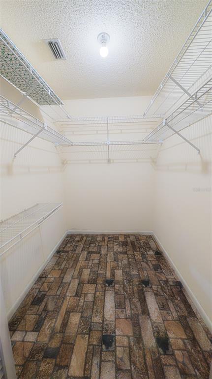 9357 Southwest 82nd Terrace, Unit C Ocala, FL 34481 - Photo 18 of 30 a view of a room with racks on the wall