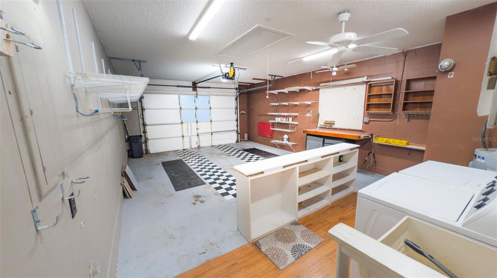 9357 Southwest 82nd Terrace, Unit C Ocala, FL 34481 - Photo 24 of 30 a kitchen with a stove and a refrigerator