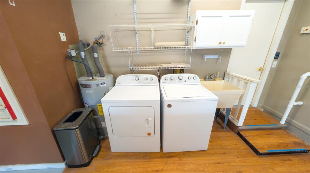 9357 Southwest 82nd Terrace, Unit C Ocala, FL 34481 - Photo 25 of 30 a utility room with dryer and washer