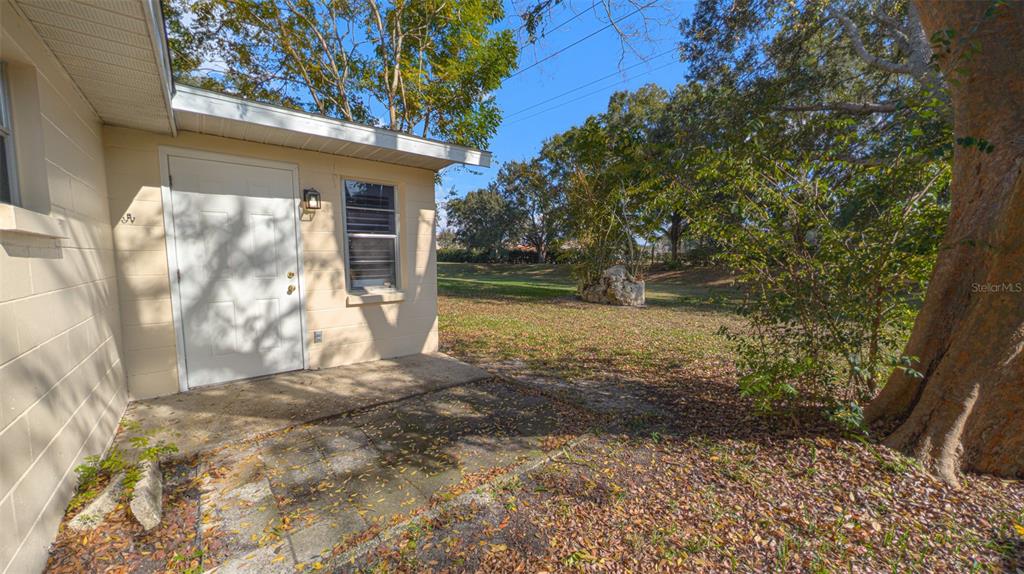 9357 Southwest 82nd Terrace, Unit C Ocala, FL 34481 - Photo 26 of 30 a view of back yard of the house