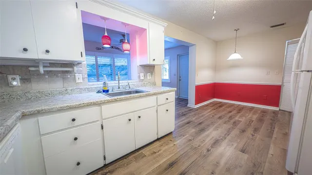 a view of a kitchen and a window