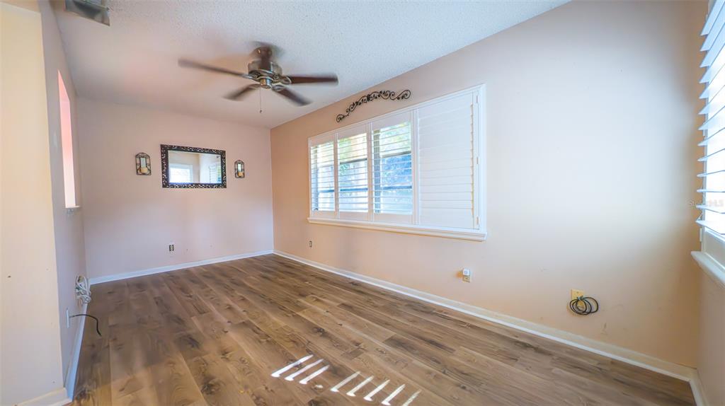 9357 Southwest 82nd Terrace, Unit C Ocala, FL 34481 - Photo 9 of 30 a view of an empty room with a window