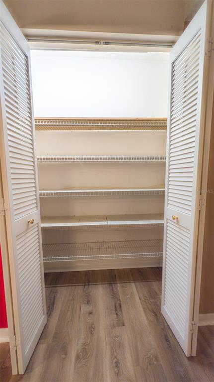 9357 Southwest 82nd Terrace, Unit C Ocala, FL 34481 - Photo 10 of 30 a view of walk in closet with empty racks