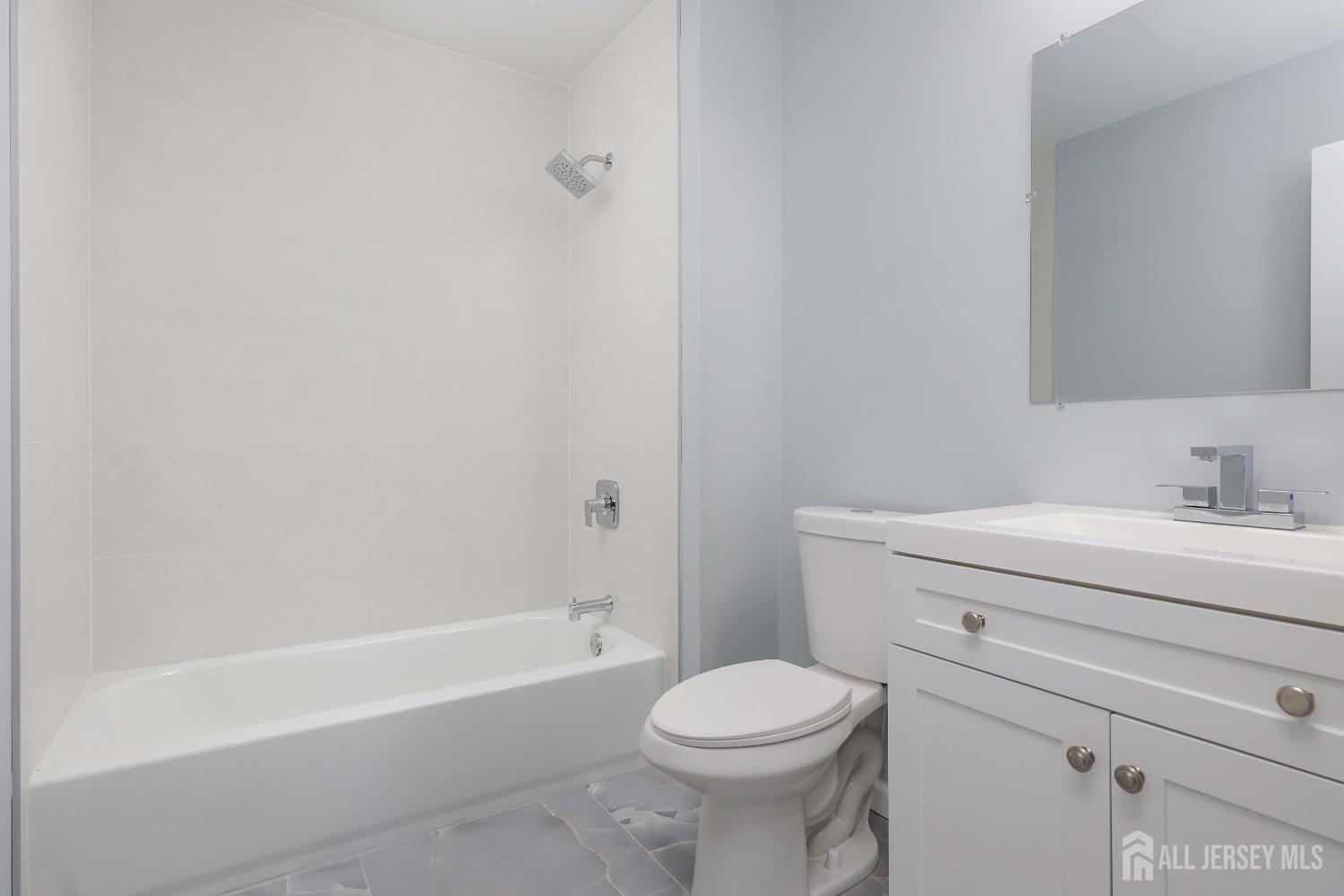 4 Ellison Court Keyport, NJ 07735 - Photo 26 of 37 a bathroom with a sink a toilet and bathtub