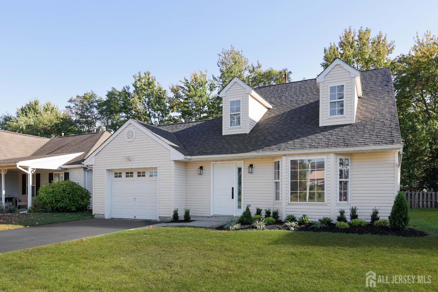 4 Ellison Court Keyport, NJ 07735 - Photo 36 of 37 a front view of a house with a garden