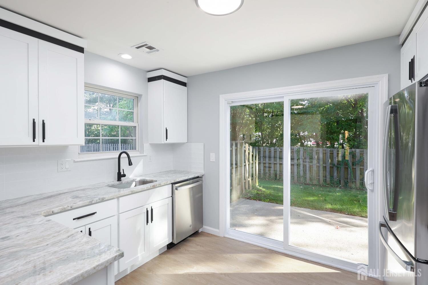 4 Ellison Court Keyport, NJ 07735 - Photo 5 of 37 a kitchen with a sink and large window