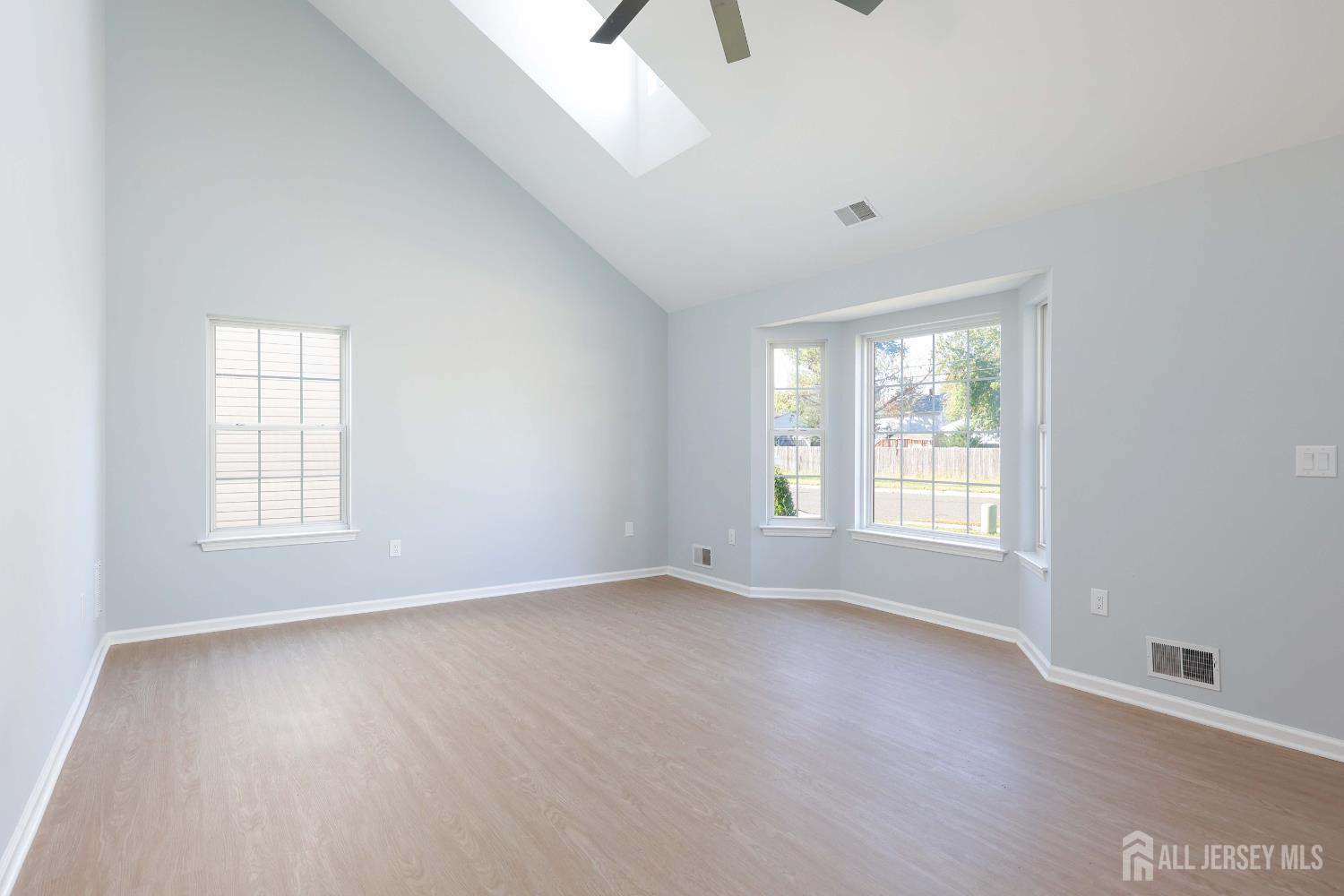 4 Ellison Court Keyport, NJ 07735 - Photo 10 of 37 an empty room with wooden floor and windows