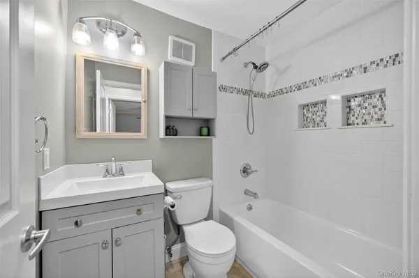 a kitchen with stainless steel appliances granite countertop a refrigerator a stove and a sink