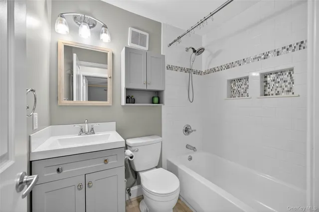 a kitchen with stainless steel appliances granite countertop a refrigerator a stove and a sink