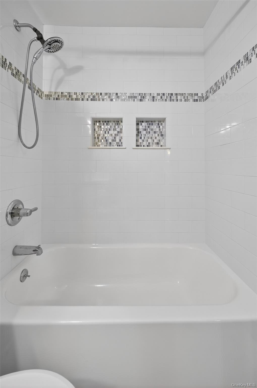 10 Secora Road, Unit L12 Monsey, NY 10952 - Photo 10 of 24 a bathroom with a bath tub and a shower