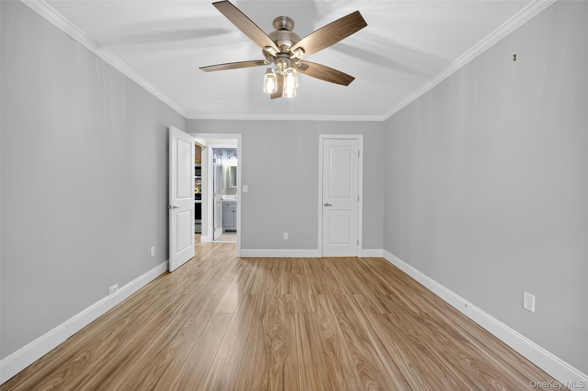 10 Secora Road, Unit L12 Monsey, NY 10952 - Photo 13 of 24 wooden floor in an empty room with a window