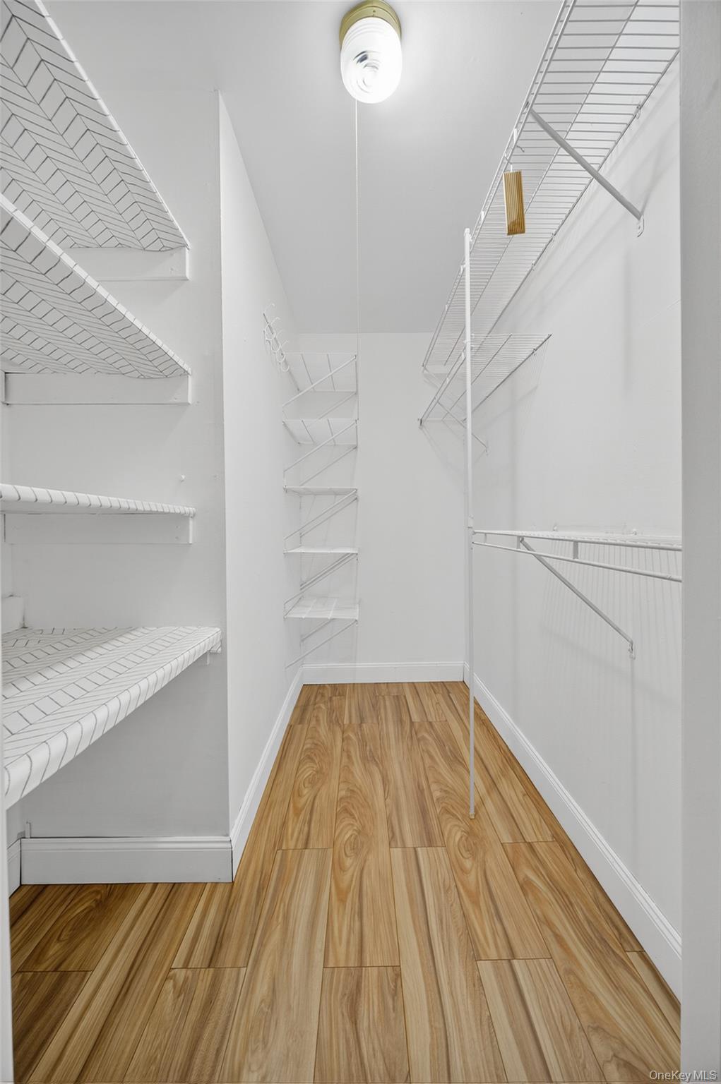 10 Secora Road, Unit L12 Monsey, NY 10952 - Photo 15 of 24 a view of a room with wooden floor