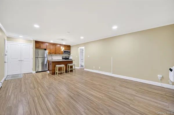 a view of kitchen with furniture and wooden floor