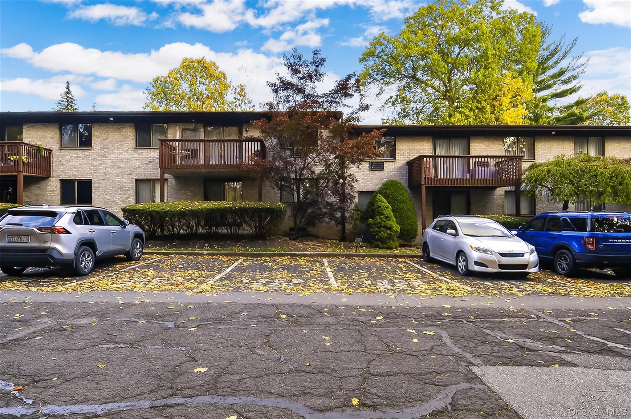 10 Secora Road, Unit L12 Monsey, NY 10952 - Photo 20 of 24 a front view of a house with garden