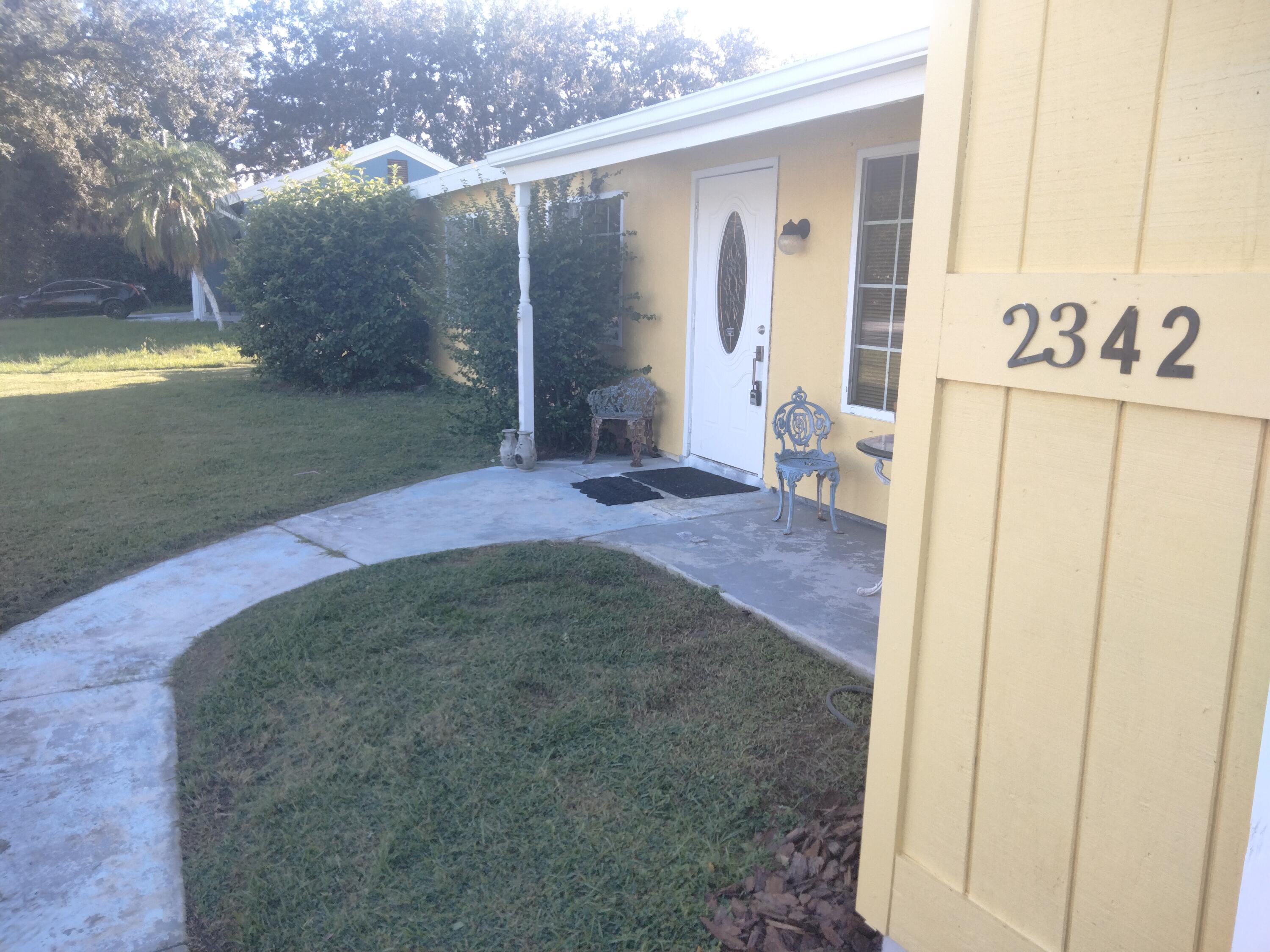 2342 Southeast Midtown Road Port St. Lucie, FL 34952 - Photo 2 of 12 Front Close 2