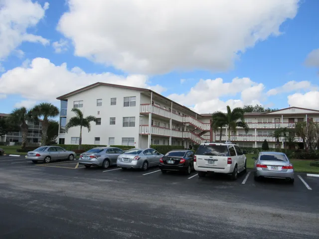 a view of a cars parked in front of a building